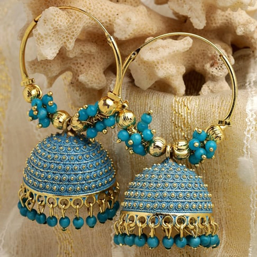Handcrafted royal blue and gold Meenakari Jhumka earrings with bead tassels on a neutral coral background - Panachemode Sydney.