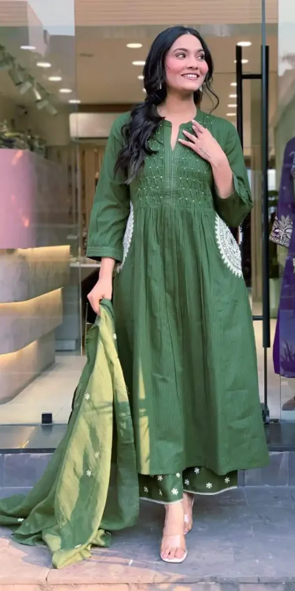 Olive green cotton suit set with Pintex neck design and hand-embroidered pockets.